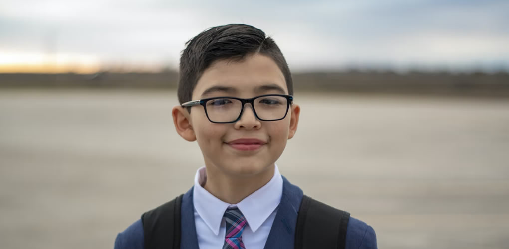 boy wearing school shirt and blazer